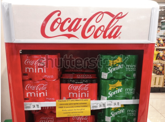 Coca-cola mini and sprite mini in a fridge, branding design apparent.