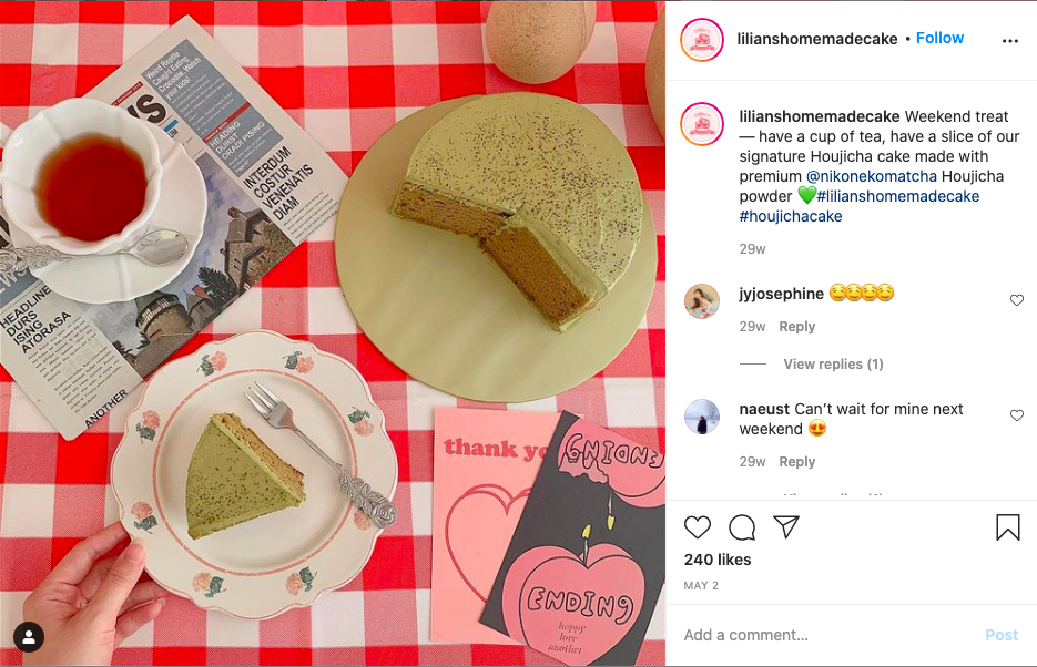 lilian's homemade cake shop on instagram, matcha flavor, with a cup of tea on the side and newspaper.