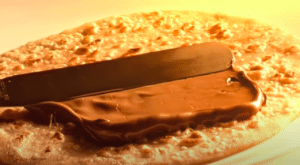 Nutella spread on Indian flatbread in a commercial, example of localized advertising